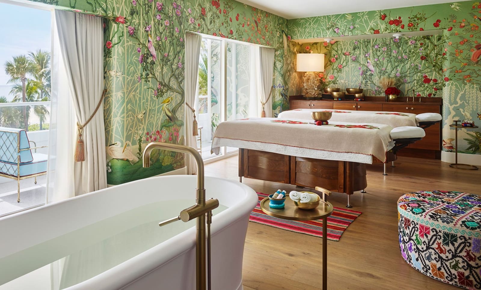 Spa treatment suite with hand-painted botanical wallpaper, soaking tub and singing bowls at Faena Hotel Miami Beach