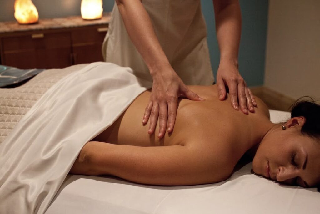 Back massage with Himalayan salt lamps in the treatment room at VH Spa at Hotel Valley Ho, Scottsdale