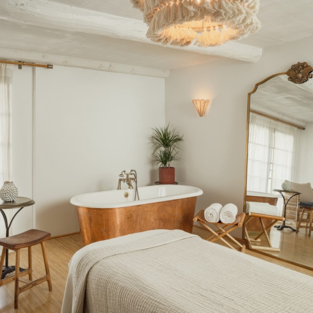 La Vidorra Spa treatment room with copper freestanding bath and macramé chandelier at The Scott Resort and Spa, Scottsdale, Arizona