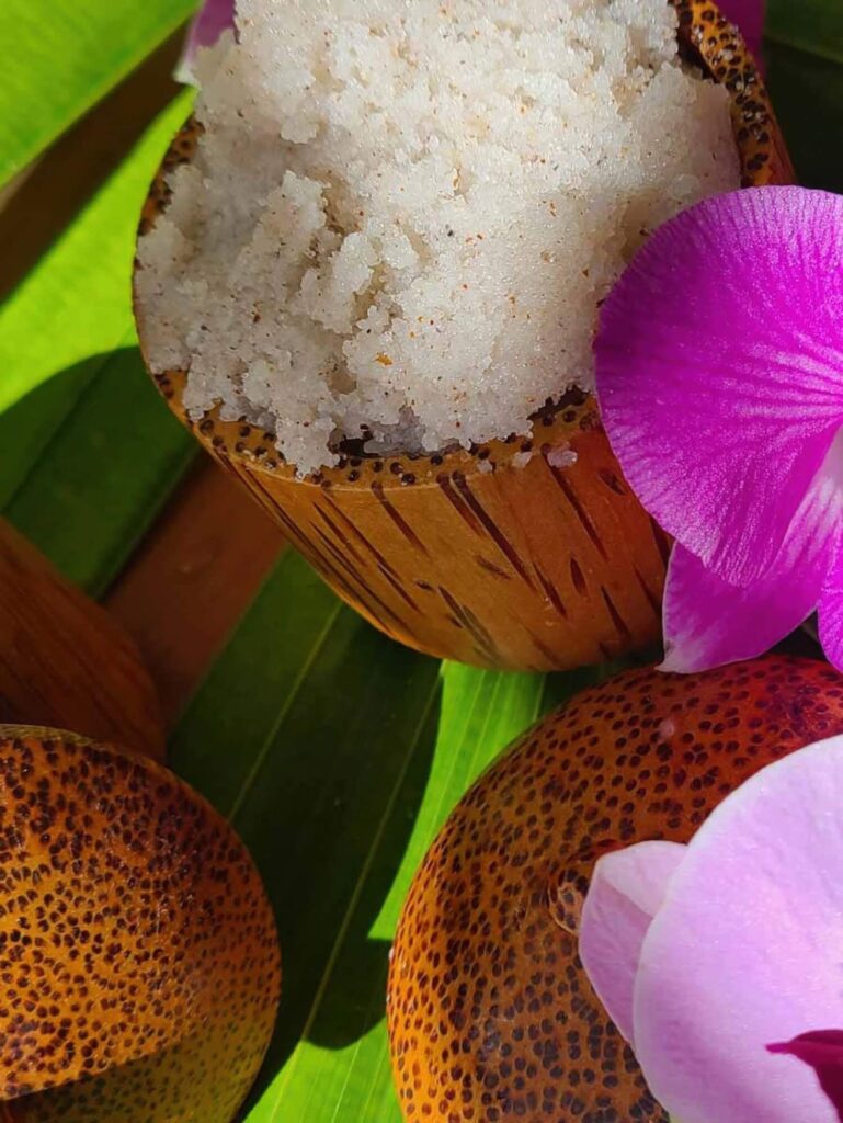 Close-up of salt scrub in coconut shell with orchid petals at Ocean Key Resort & Spa, Key West Florida