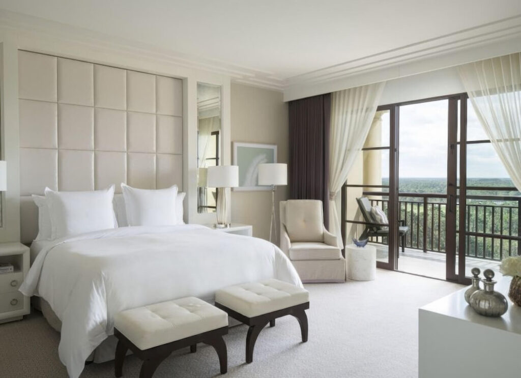 Deluxe king room with balcony and forest view at Four Seasons Resort Orlando at Walt Disney World, Orlando, Florida.