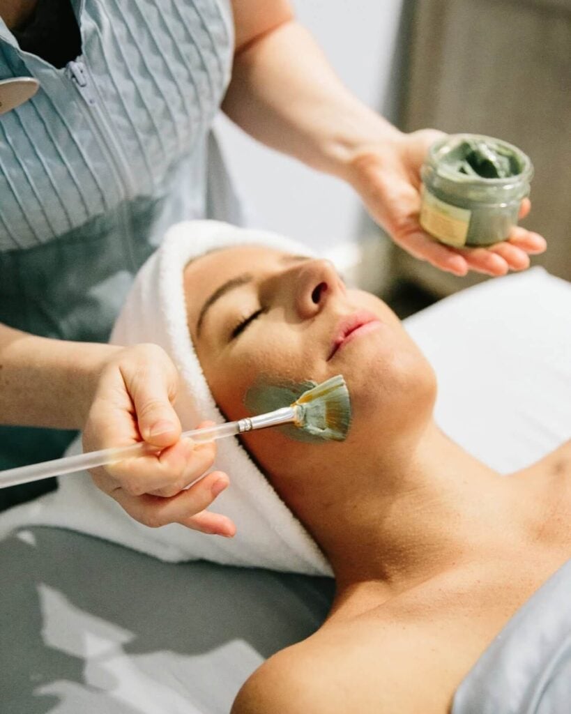 Guest receiving a clay-mask facial at Opal Spa, Opal Sands Resort, Clearwater Beach, Florida