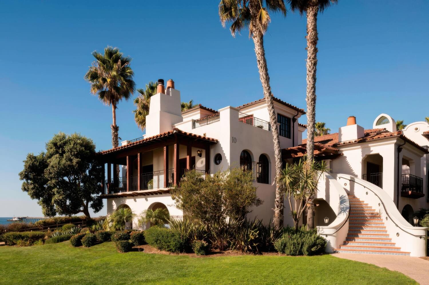 White Spanish-Colonial guest building with a red-tile roof and tiled staircase above the ocean at The Ritz-Carlton Bacara, Santa Barbara