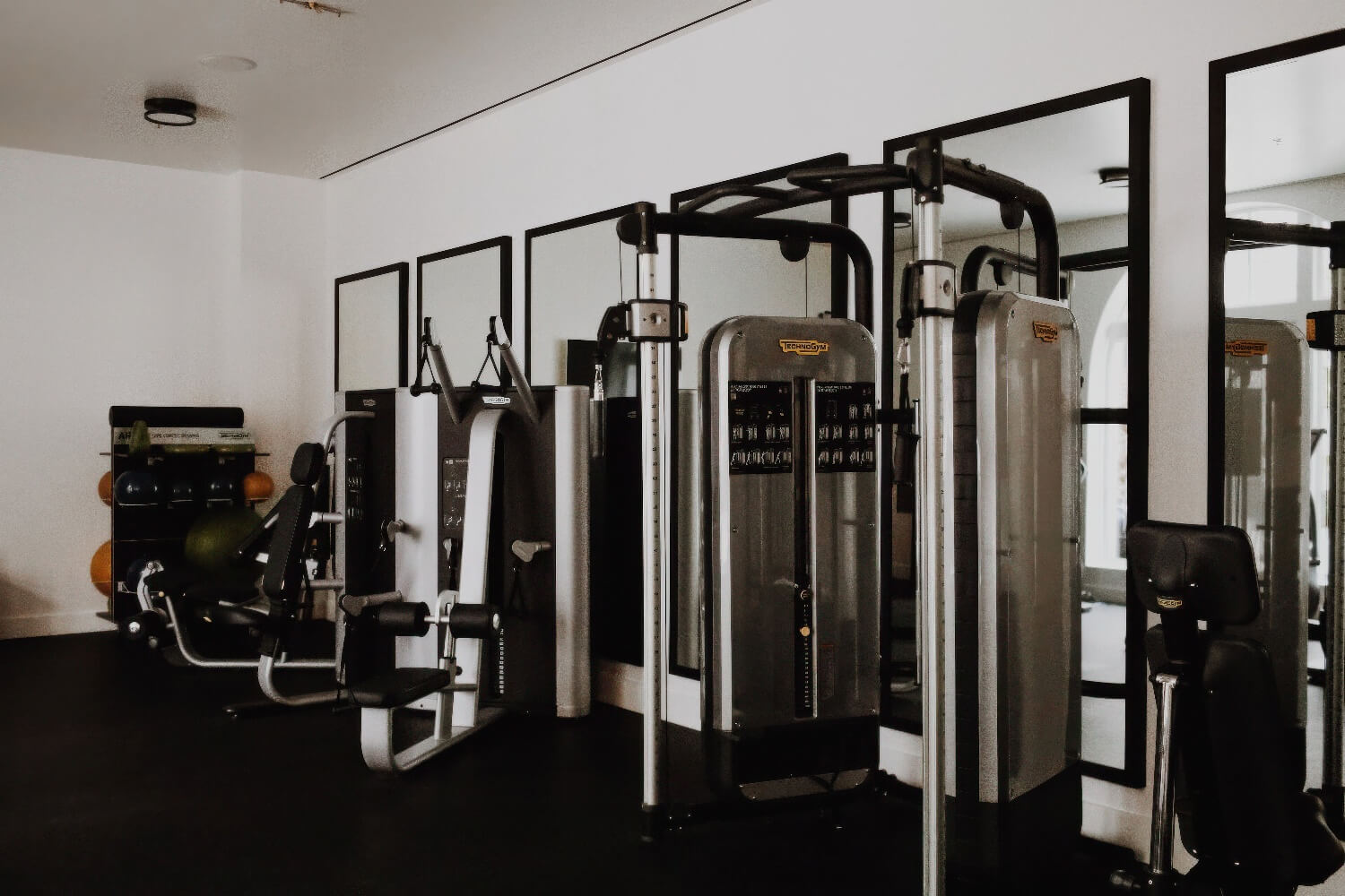Fitness centre lined with mirrors and Technogym strength stations at Hotel Californian, Santa Barbara