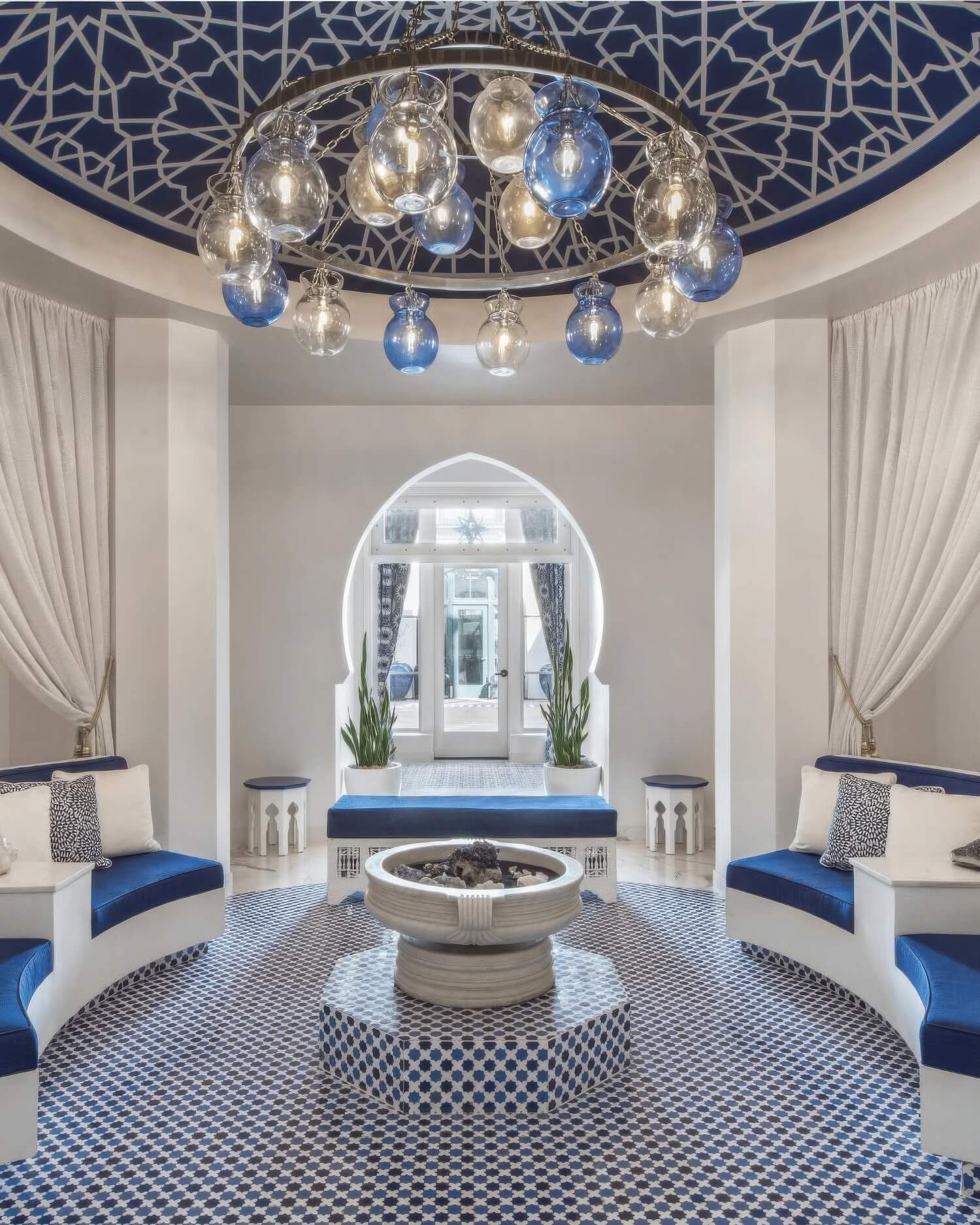 Domed Moroccan spa rotunda with blue banquettes, mosaic floor and a glass-orb chandelier at Hotel Californian, Santa Barbara