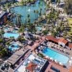 Aerial view of the spring-fed lake, mineral pools and red-tile bathhouse at Murrieta Hot Springs Resort, California