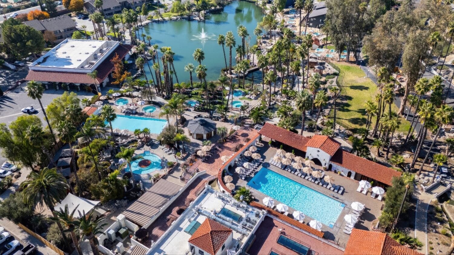 Aerial view of the spring-fed lake, mineral pools and red-tile bathhouse at Murrieta Hot Springs Resort, California