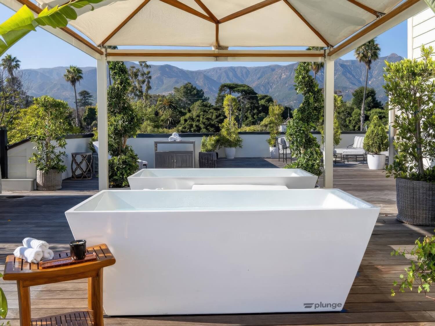Cold plunge tubs under a canopy on the rooftop wellness terrace facing the mountains at Rosewood Miramar Beach, Montecito
