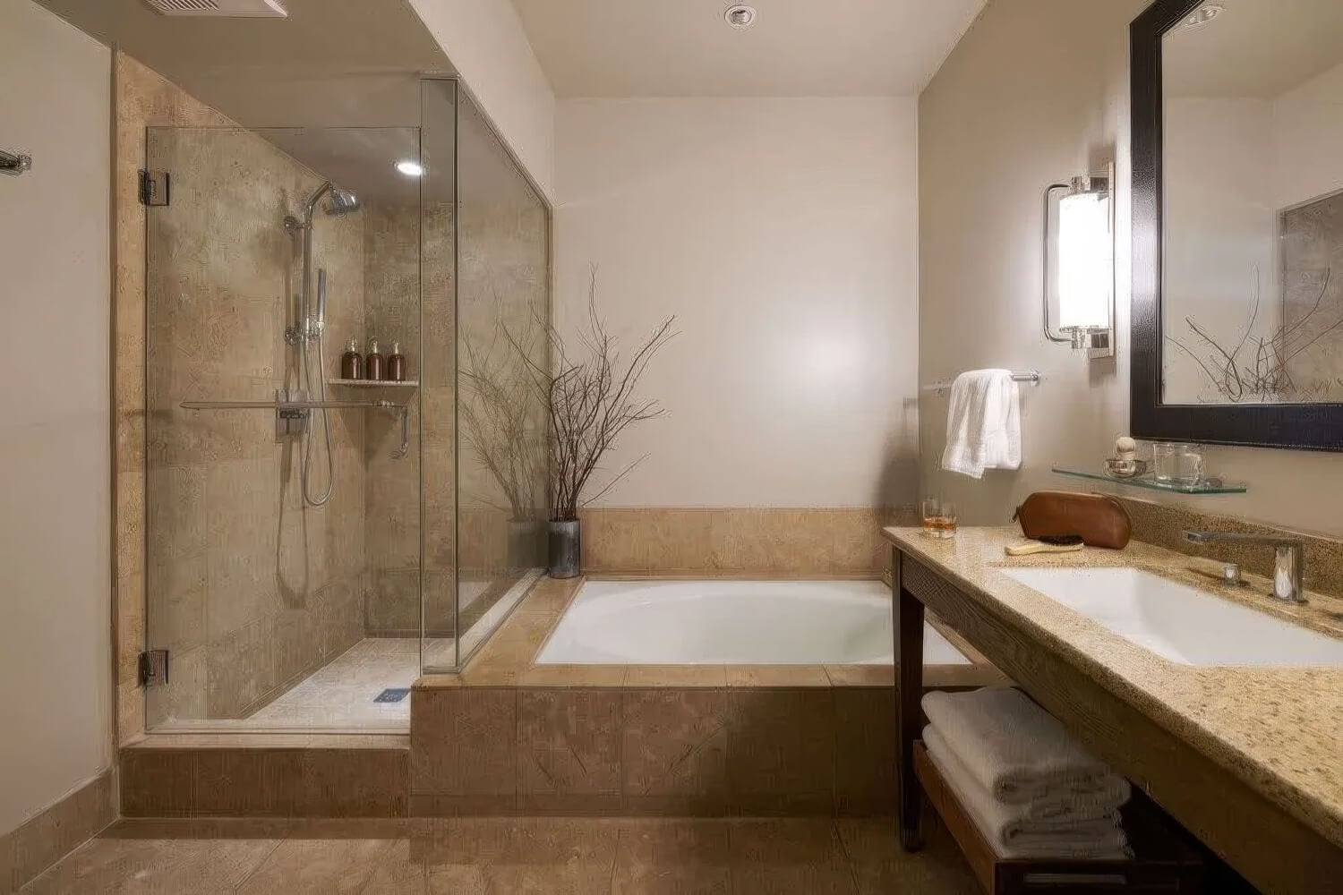Suite bathroom with deep soaking tub, glass walk-in shower and stone vanity at Carmel Valley Ranch, Carmel Valley