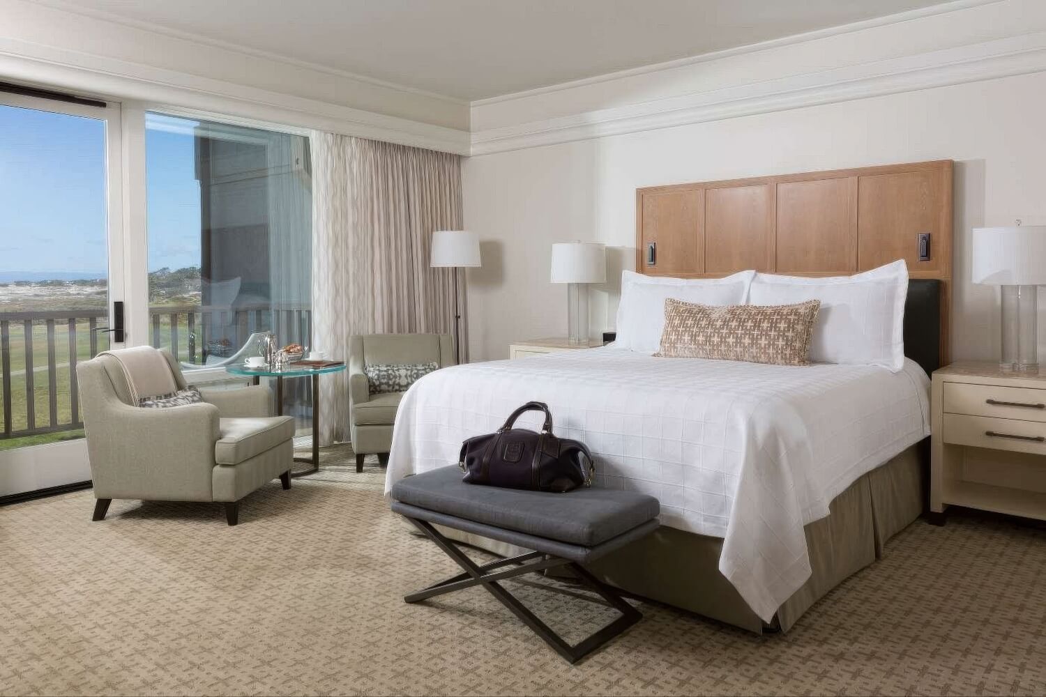 King guest room with balcony over fairway and distant ocean at The Inn at Spanish Bay, Pebble Beach